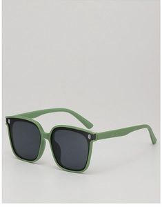 Macro view of green rectangular sunglasses frame with silver metal accent and dark lens