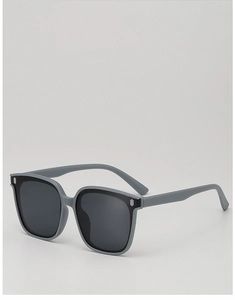 Detailed view of oversized grey kids' sunglasses with square frames and UV lenses
