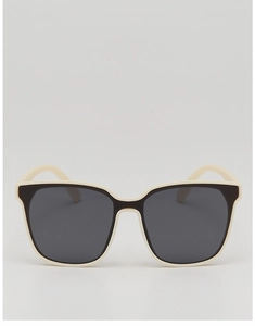 Close-up of kids' oversized square sunglasses with cream and black frames and gray lenses