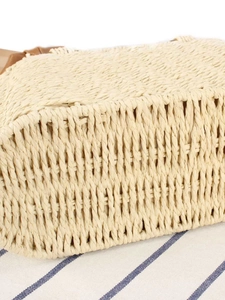 Minimalist straw weave shoulder bag with faux leather straps for summer beach vacations