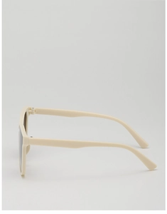 Side view of beige kids sunglasses showing thick frame and dark UV protection lenses