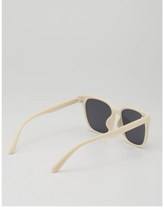 Rear view of cream retro kids sunglasses with dark lenses and durable resin frame