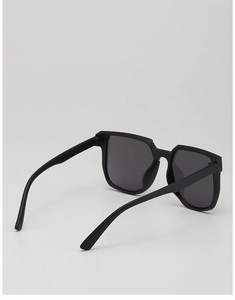 Detail view of matte black oversized square kids sunglasses with integrated nose pads
