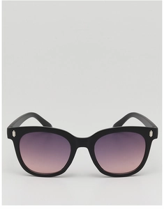 Close-up of black cat-eye kids sunglasses with gradient lenses and silver metal hinges
