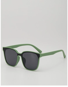 Close-up of green square frame children sunglasses with dark lenses for UV protection