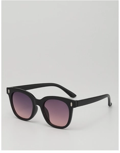 Close-up of stylish children's sunglasses with silver metal studs and purple gradient lenses