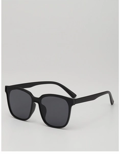 Detail view of stylish kids oversized black sunglasses with dark UV protection lenses
