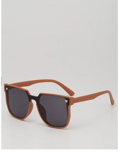 Close-up of square oversized children's sunglasses with brown frames and silver accents