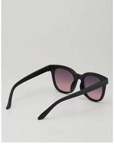 Side view of trendy cat-eye kids sunglasses with black frames and gradient lenses