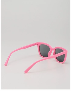 Detail of pink children's sunglasses showing wide temples and dark gray lenses