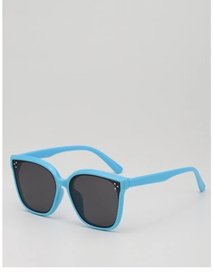 Detail of light blue children's sunglasses with three white rivets and grey lenses