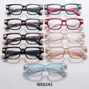Vista plana de monturas de gafas retro cat eye en varios colores con detalles de perlas