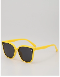 Detail of yellow kids square sunglasses with UV protection lenses and silver rivet studs