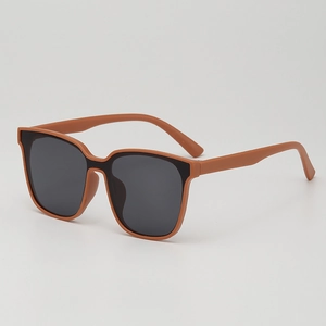 Kids one-piece frame sunglasses with matte coral orange finish and UV protection