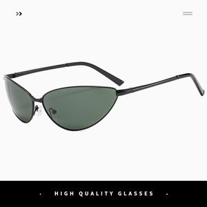 Detail of trendy small cat-eye sunglasses with dark green lenses and black metal frame