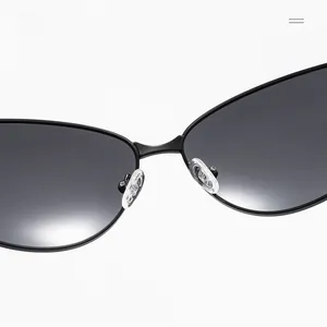 Detail of adjustable silicone nose pads and sturdy bridge on metal cat eye sunglasses