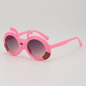 Pink cartoon ant-style sunglasses for kids with UV protection and round gradient lenses