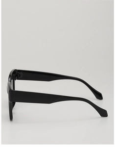 Detail view of stylish black oversized sunglasses with thick glossy plastic frames