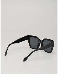 Detail view of the sleek black oversized square frame sunglasses with thick temples