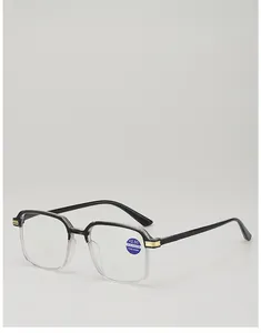 Macro detail of reading glasses featuring black frames with stylish gold metal accents