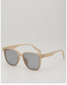 Vue détaillée des lunettes de soleil carrées kaki avec rivets en métal et verres UV