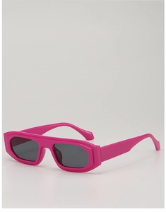 Macro detail of rose pink square sunglasses featuring thick frames and dark grey lenses