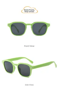 Détail de lunettes de soleil rétro vert fluo pour enfants avec verres UV gris foncé