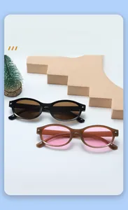 Detail of round kids sunglasses in black and translucent brown frames with protective lenses