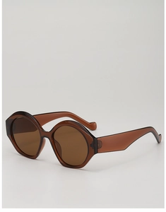 Dettaglio degli occhiali da sole vintage marrone scuro con montatura spessa in acetato