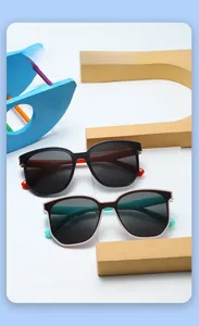 Close-up of colorful color-blocked UV protection sunglasses for kids on bright blocks