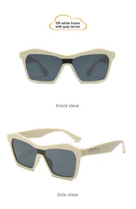 Detail view of cream white kids sunglasses with grey lenses and silver temple accents