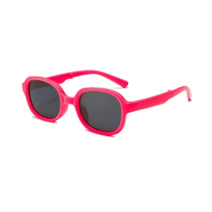 Foldable kids sunglasses in bright rose red frame with UV protection for outdoor travel
