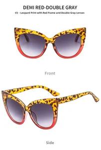 Close-up of cat eye sunglasses with tortoise and red contrast frame and gradient lenses