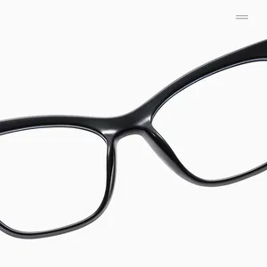 Macro detail of the smooth bridge and polished black TR90 cat eye frame rims