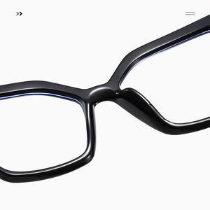 Macro shot of black acetate frame bridge and temple hinges of anti-blue light glasses