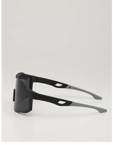Side view of matte black cycling glasses with hollow temples and oversized polarized lens