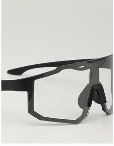 Detail of matte black cycling glasses frame with anti-slip textured temples and wide lens