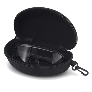 Close-up of portable black zipper sunglasses case with hook and clear sport safety glasses