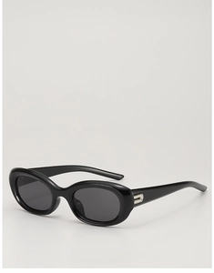 Detail of vintage oval black sunglasses featuring a sleek silver metal hinge decoration