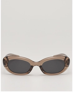 Detail of translucent tea-grey cat-eye sunglasses with premium dark grey polarized lenses