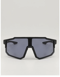 Detail of black sports cycling sunglasses with dark grey lenses and non-slip temple texture