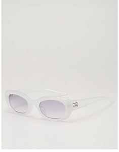 Detail of cat eye sunglasses with white translucent frame and purple gradient lenses