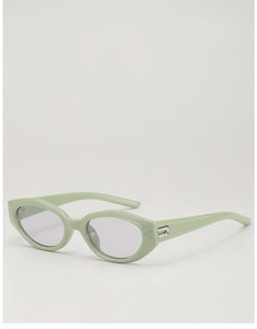 Detail of light green cat-eye sunglasses with silver metal accents and purple tinted lenses