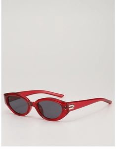 Detail view of retro red cat-eye sunglasses featuring silver metal accents and gray lenses
