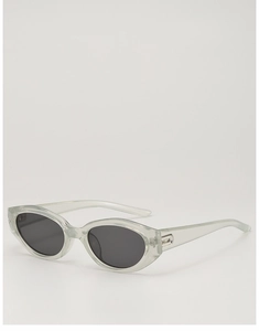 Detail of silver hinges on cat-eye sunglasses with transparent grey frames and dark lenses