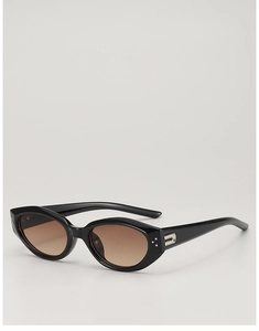 Detail of black cat-eye sunglasses with silver metal accents and brown tinted lenses