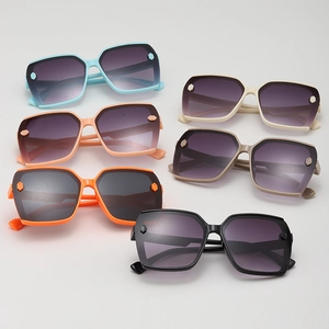 Flat lay of stylish square kids sunglasses in six assorted colors with gradient lenses