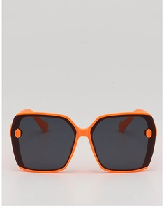 Detail of bright orange oversized square sunglasses with dark UV protective lenses
