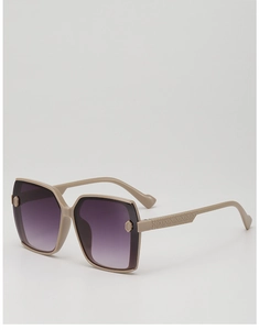 Detail of light beige sunglasses frame with gradient purple lenses and embossed patterns