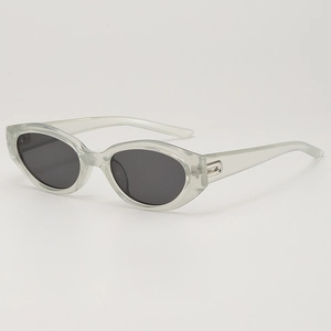 Retro cat-eye sunglasses with transparent grey frame and dark lenses, 45-degree angle